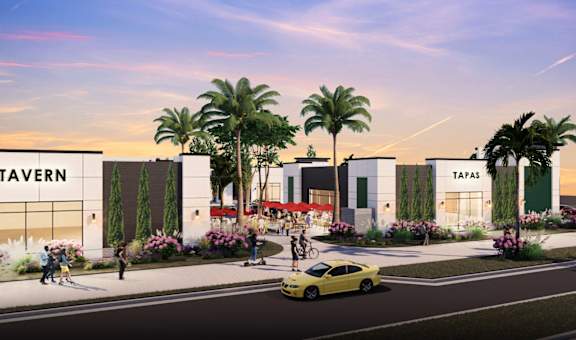 A street view of a Tavern and Tapas restaurant with palm trees and people walking.