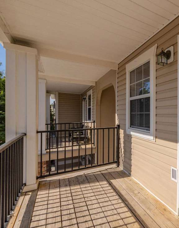 an empty street in front of a building with a sign on the side at Sterlington Apartments, Grovetown, GA, 30813