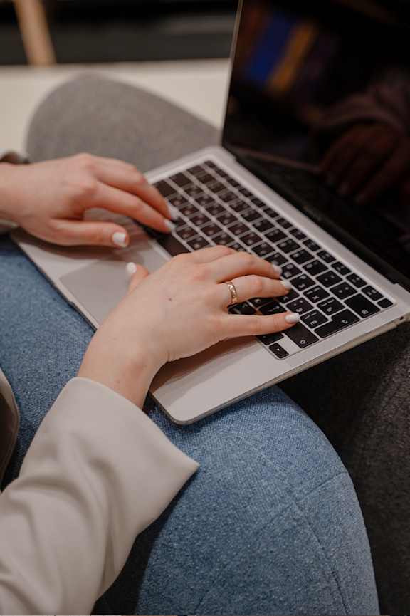 A person is typing on a laptop
