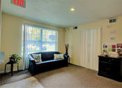 Thumbnail 4 of 15 - Image of carpeted room with furniture and window