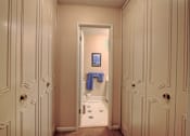 Thumbnail 17 of 25 - Image of hallway with large closet and entrance to bathroom