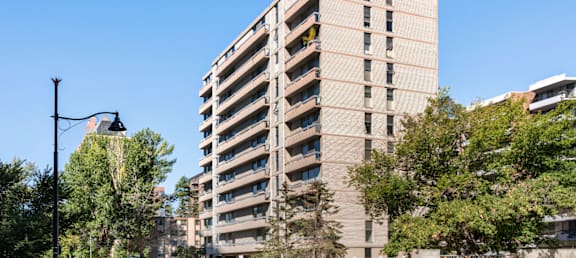 an apartment building on the corner of a street