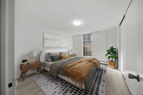 a bedroom with a bed and a rug