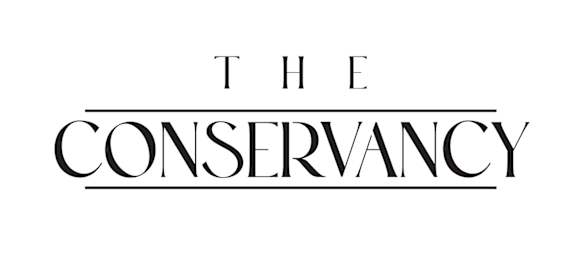 the logo for rwk with a blue swoosh