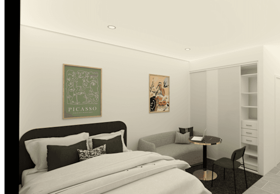 A bedroom with a bed, a chair, and a painting on the wall.