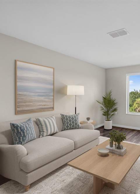 a rendering of an apartment complex with cars parked in front of it at The Stillwaters 62+ Apartment Homes, Apopka, FL, 32712