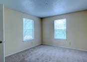 Thumbnail 11 of 15 - Image of large room with carpeting and windows
