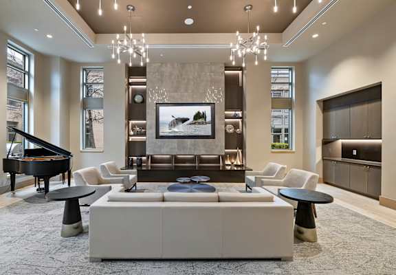 a living room filled with furniture and a flat screen tv