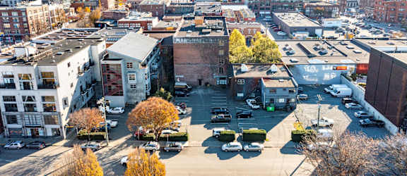 A cityscape with buildings and cars.
