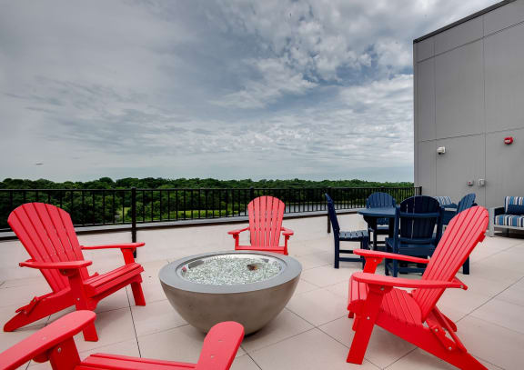 rooftop patio with firepit, grills and seating at Lake Jonathan Flats community