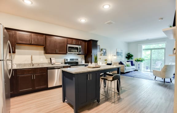 beautiful kitchen with granite and stainless steel appliances at Lake Jonathan Flats community