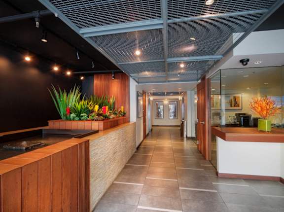 A long hallway with a wooden counter on the left and a white counter on the right at 1022 Tiverton, Los Angeles, CA
