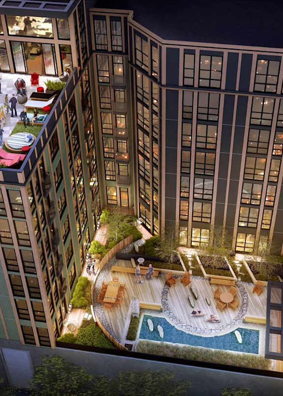 a rendering of a building with a pool and courtyard at night