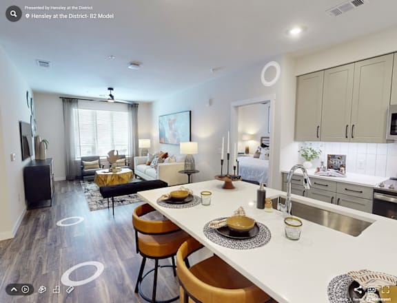 A modern kitchen with a dining table and chairs.