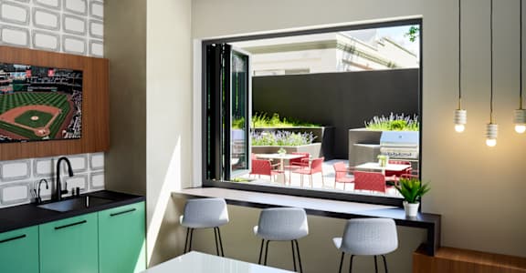 a kitchen with a table and chairs and a large window