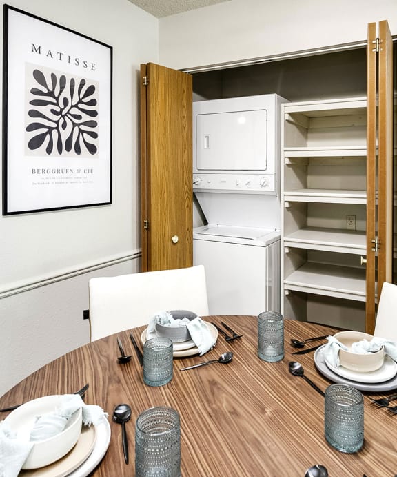 a laundry room with a washer and dryer and a closet