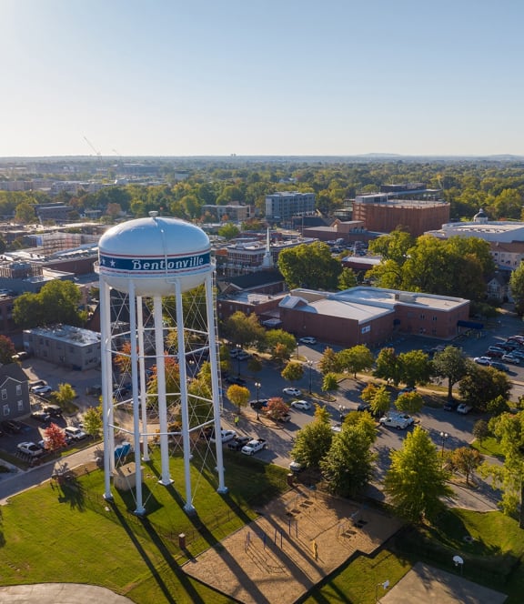 an aerial view of a water tower in the middle of a city