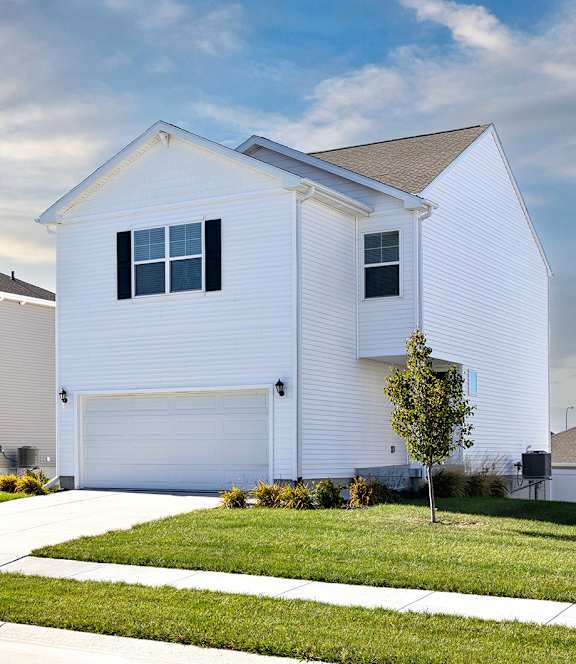 A row of houses with a clear sky above them.