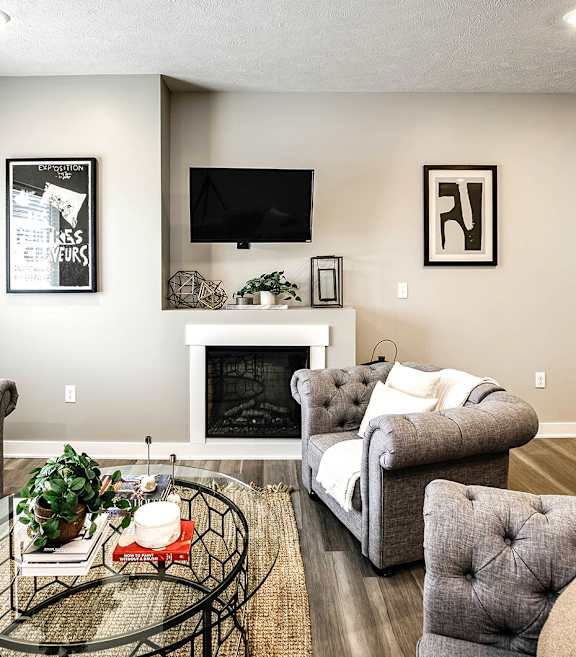 a living room with couches and a coffee table