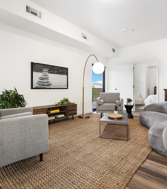 a living room with couches and chairs and a table