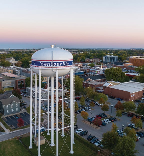 an aerial view of a water tower in the city