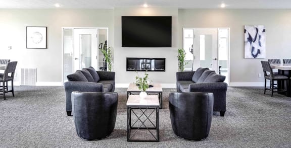 a living room with couches and a tv