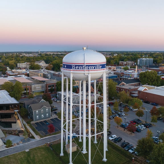 an aerial view of a water tower in the middle of a city