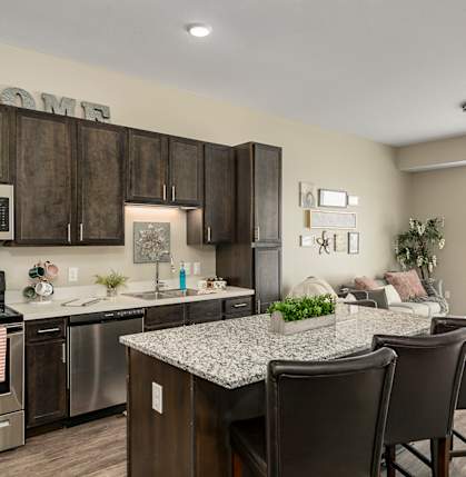 our apartments offer a kitchen and living room with a table