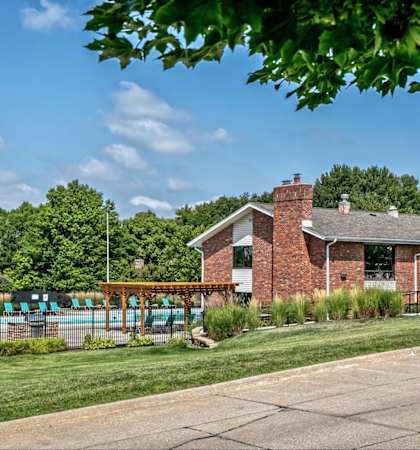 a house with a pool in front of it