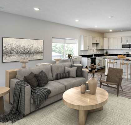a living room and kitchen with a couch and a table