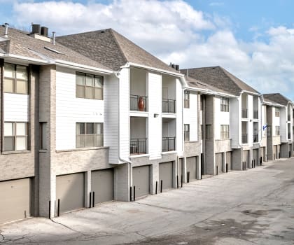 a row of townhomes with a street in front