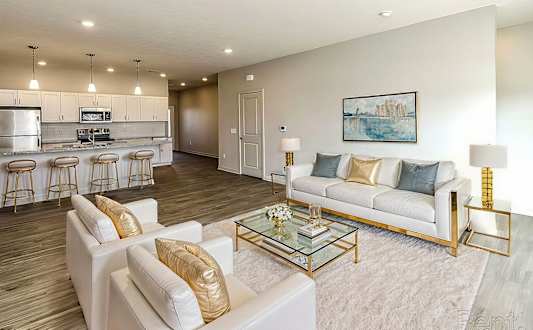 white sofa in living room at Sandstone Villas Apartments, Omaha, NE 68116