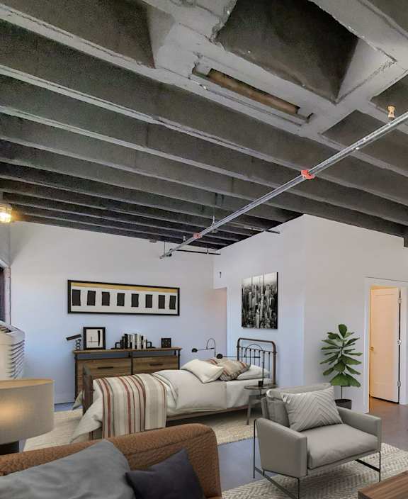 A living room with a green couch and a wooden coffee table.