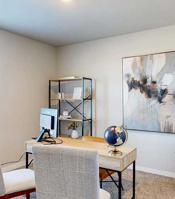A modern dining room with a wooden table set for two.