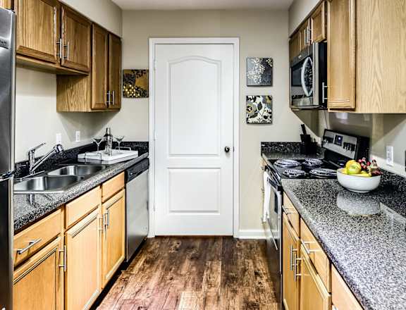 Large kitchens with stainless steel appliances at The Larimore Apartments, Omaha, 68164