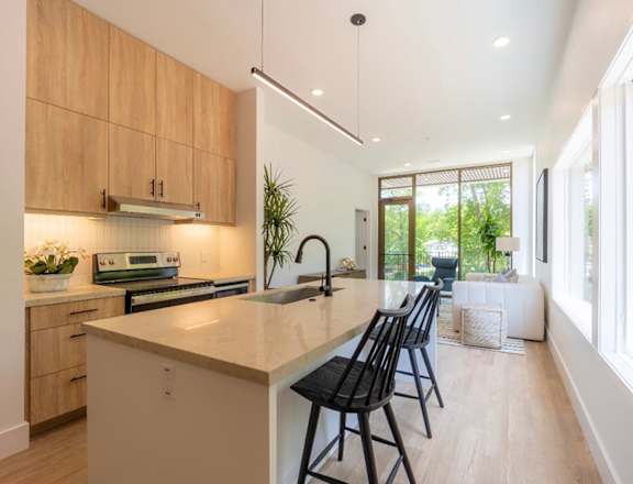 a kitchen with an island and bar stools
