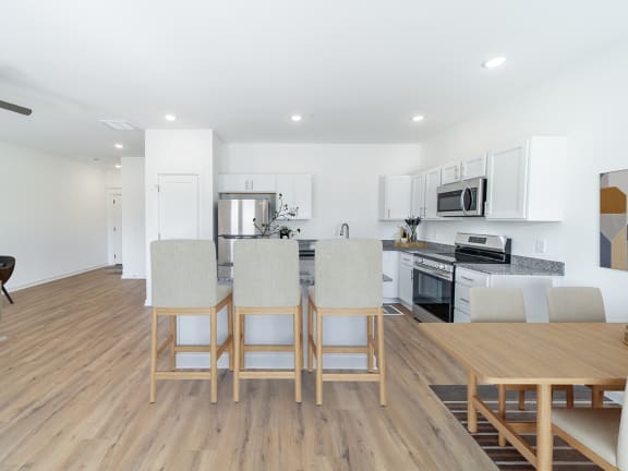 a living room with a dining room and a kitchen