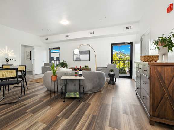 a living room with a couch and a dining room table