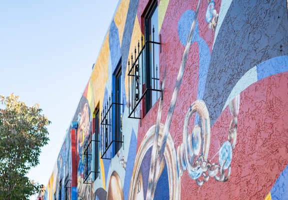 the side of a building with graffiti on it