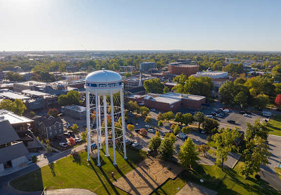 an aerial view of a water tower in the middle of a city