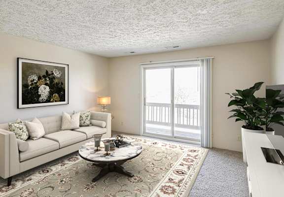 A living room with a couch, coffee table, and a painting on the wall.