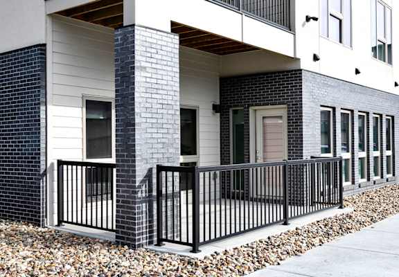 A black metal railing in front of a building.
