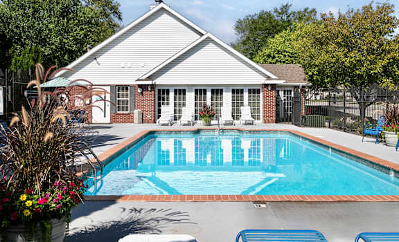 A pool in front of a house.