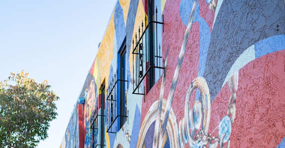 the side of a building with graffiti on it