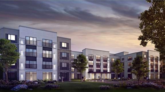 A modern apartment complex with multiple buildings and balconies is shown.