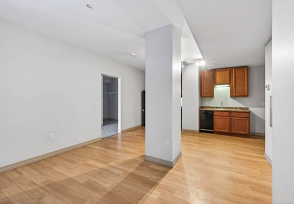 A room with wooden floors and white walls.