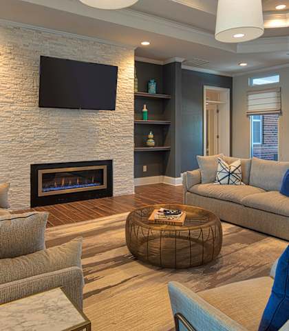 Club room with chairs and fireplace