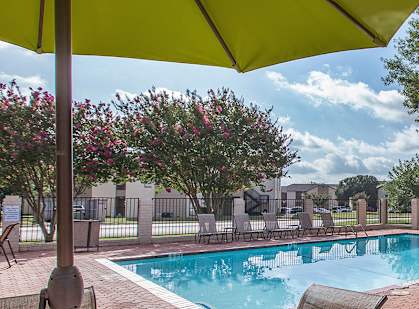 Pool and lounge chairs at GEORGETOWN PARK, Georgetown, TX