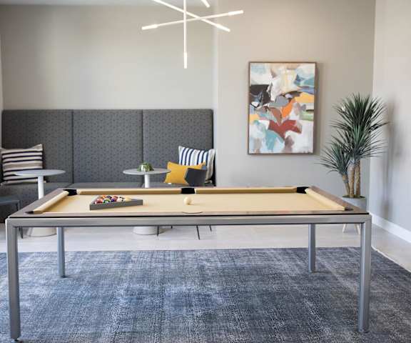 clubhouse with pool table at the bradley braddock road station apartments