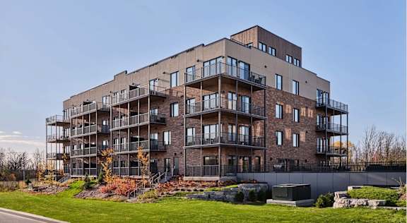 A large, modern building with many windows and balconies.